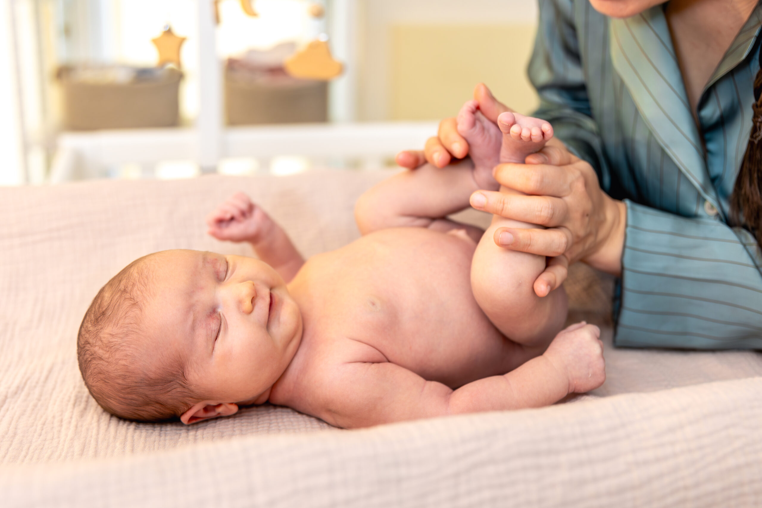 Infant massage coaching session with caregiver